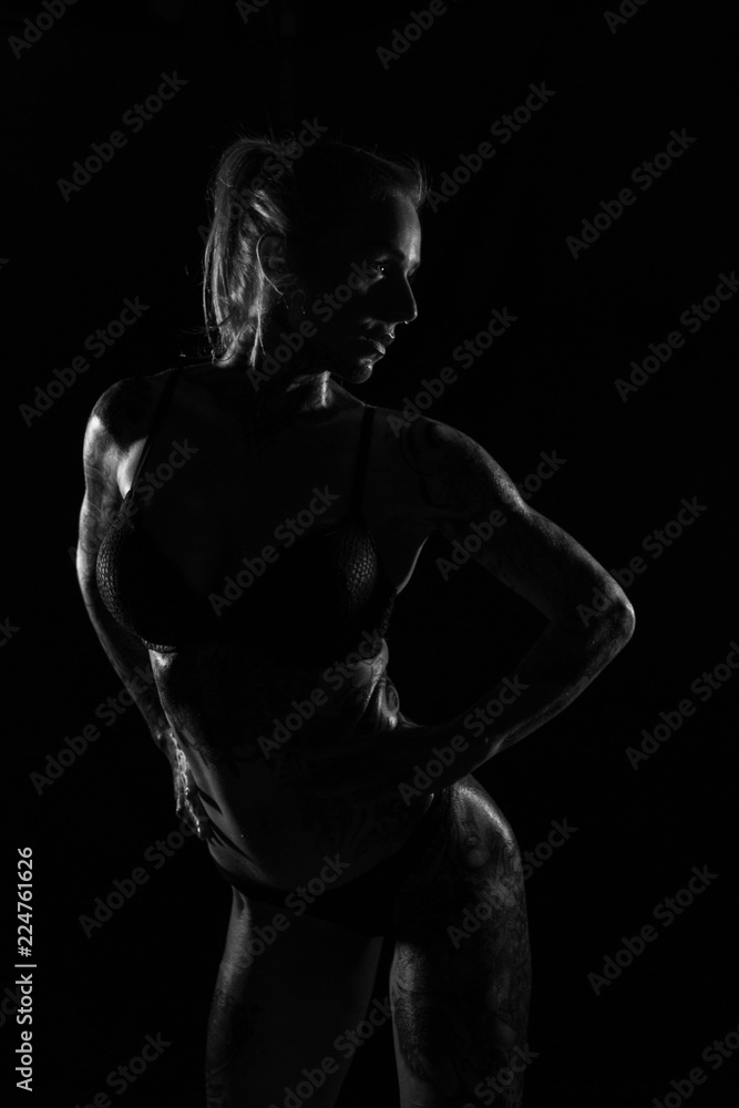 Monochrome bodyscapes of a fit tattooed woman Monochrome bodyscapes of a fit tattooed woman
