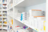 Blurred medicine and healthcare product on shelves at pharmacy drugstore