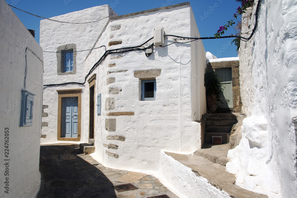 A view of streets and ancient houses in the island of Patmos, Greece in summer time