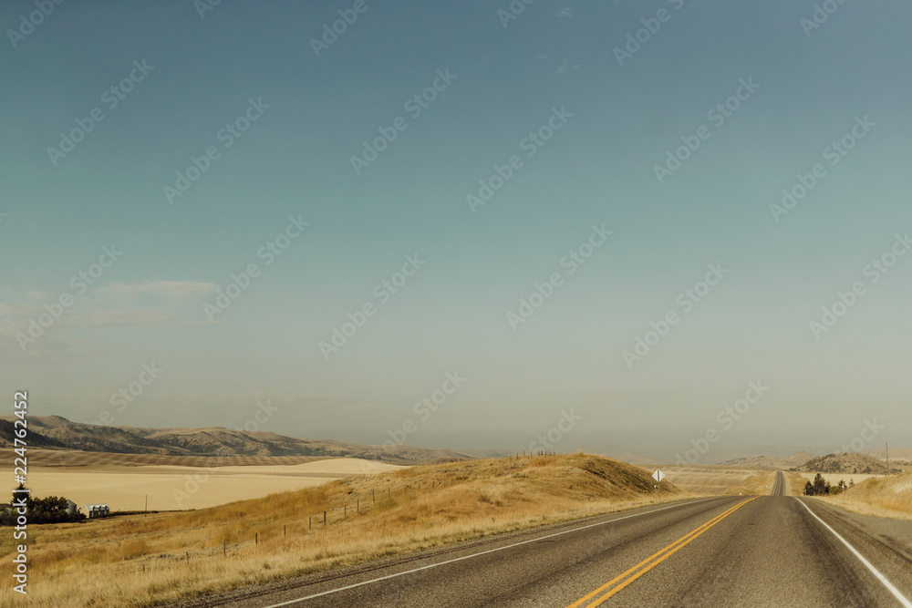 Open Highway Stretching Along Farmlands of Bozeman, Montana