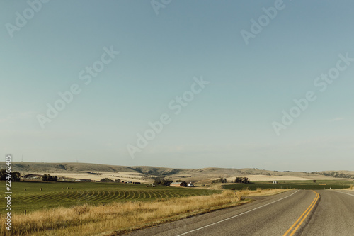 Open Highway Stretching Along Farmlands of Bozeman, Montana