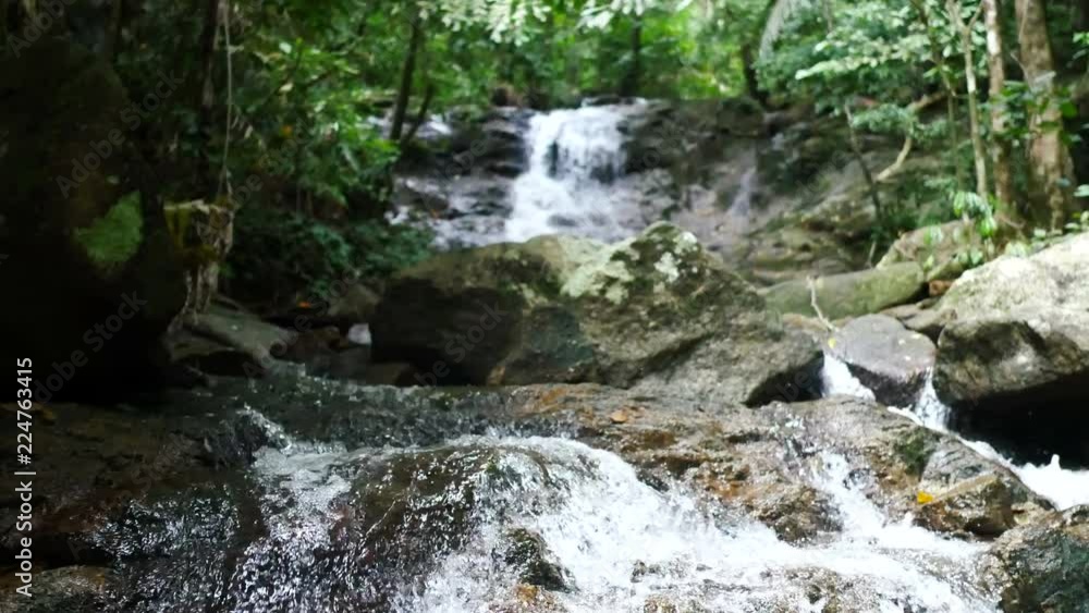 clear cold waterfall flow into rock clear cold waterfall flow into rock