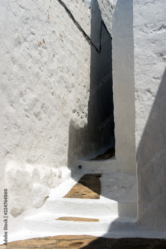 A view of streets and ancient houses in the island of Patmos, Greece in summer time