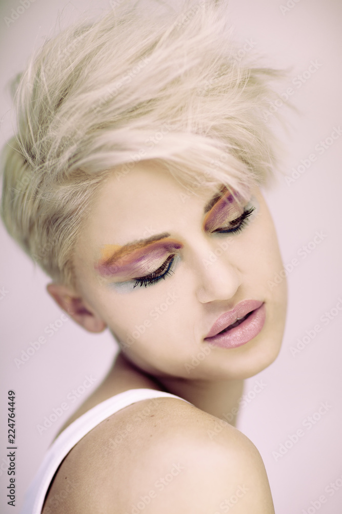 Fashion beautiful blonde woman with short haircut and colorful make up Fashion beautiful blonde woman with short haircut and colorful make up