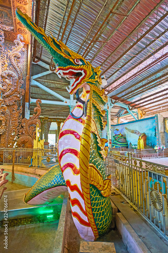 The serpent sculpture in Ngar Htat Gyi Buddha Temple, Yangon, Myanmar photo