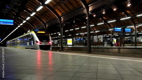 the arrival of a high-speed train to the railway station photo