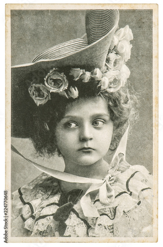Fotografie Little girl in vintage dress Old portrait picture