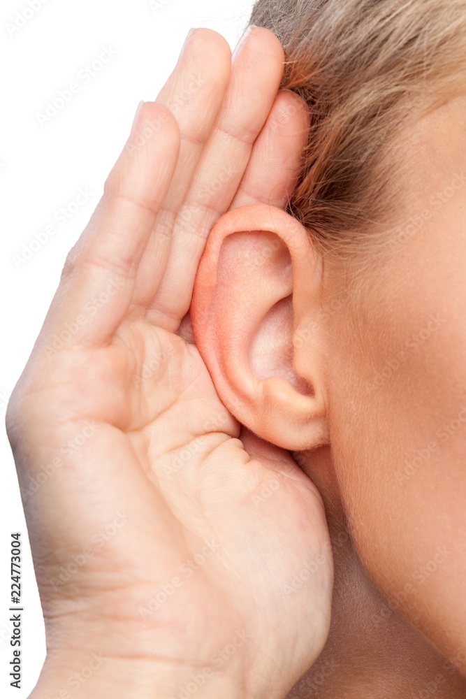 Closeup on a Woman Holding her Hand Near her Ear Closeup on a Woman Holding her Hand Near her Ear