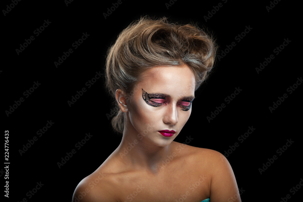 Halloween. Portrait of young beautiful girl with make-up. Isolated on black background. Halloween. Portrait of young beautiful girl with make-up. Isolated on black background.