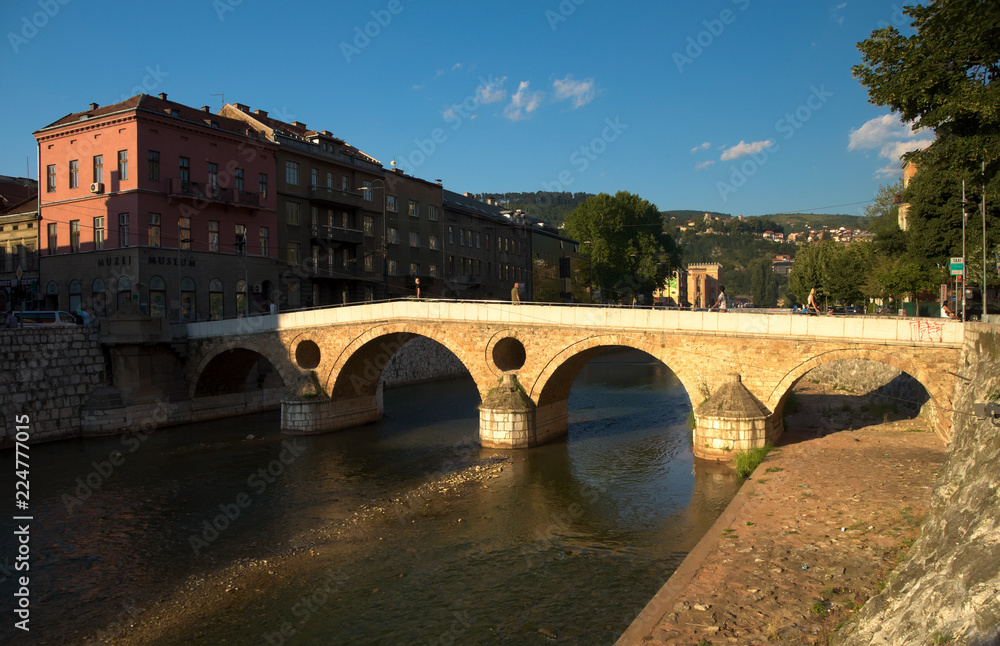 Latin bridge in the city center of Sarajevo over Miljacka river. The Sarajevo Museum is located on the right bank of the river. 