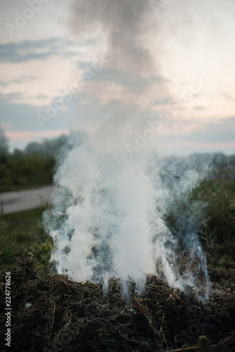 Smoke of a fading fire on the street. For use as a texture