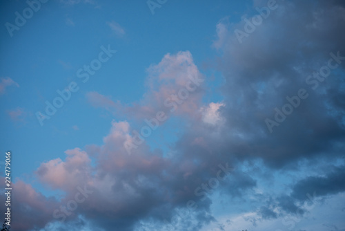 Blue sky with pink clouds bright Sunny day © Vladimir