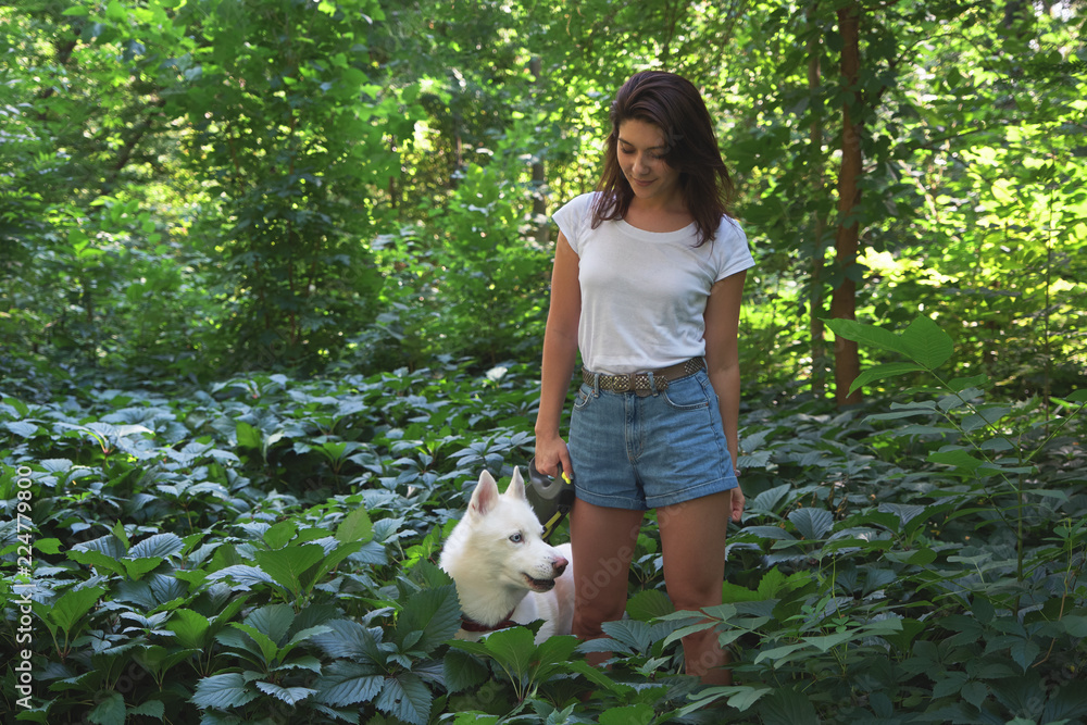 Woman spending time with her husky pet Woman spending time with her husky pet