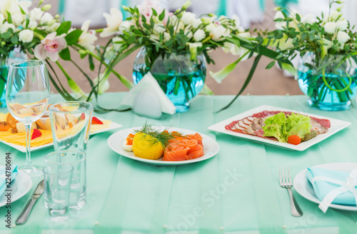 Blue wedding table with snacks and flowers