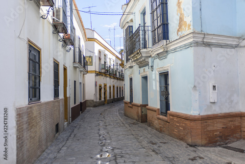 view of a street in an old quarter of Seville, Andalucia, Spain.