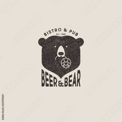 Beer and bear pub logo. The head of bear and letters emblem. Craft beer emblem. Bear keeps hop cones.