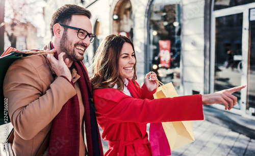 Shopping time. Young couple in shopping. Consumerism, love, dating, lifestyle concept