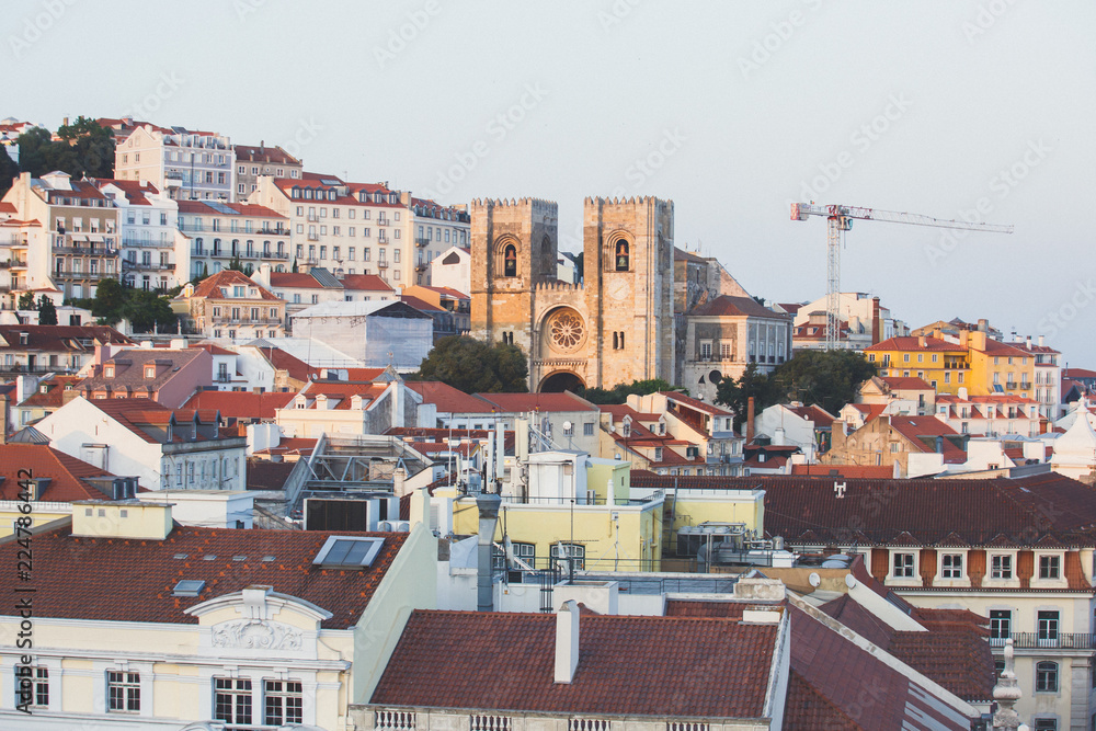 Beautiful super wide-angle aerial view of Lisbon, Portugal with harbor and skyline scenery beyond the city, shot from belvedere observation deck Rua Augusta Triumphal Arch Viewpoint, Commerce Square