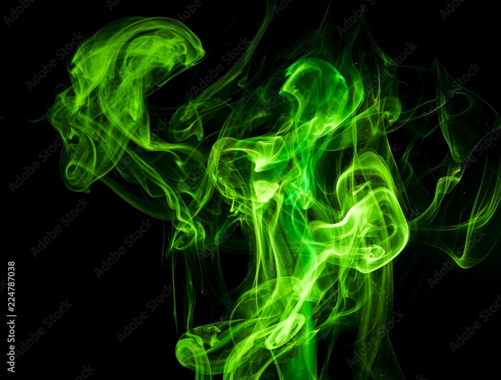 Green smoke on black background Green smoke on black background