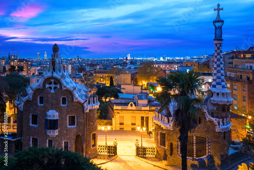 Park Guell in Barcelona, Spain at night. Barcelona skyline..