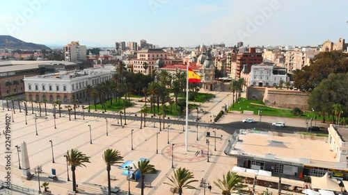 Aerial shot over Cartagena main square, Spain, Summer 2018. Large bronze statue in Cartagena