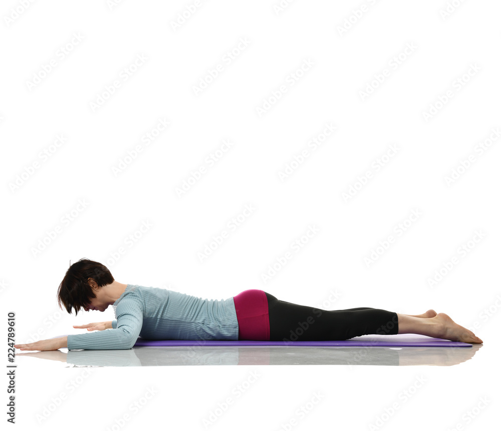 Woman exercising doing postnatal workout. Female fitness stretching hands legs abdominal exercises in gym work out Woman exercising doing postnatal workout. Female fitness stretching hands legs abdominal exercises in gym work out