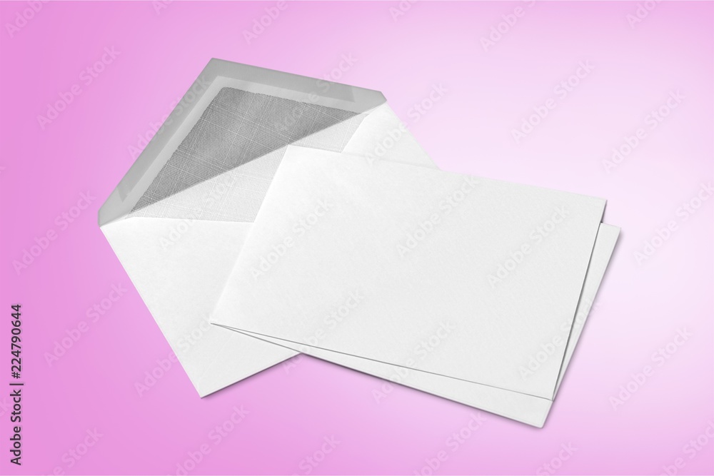 Blank white envelope and card on wooden background