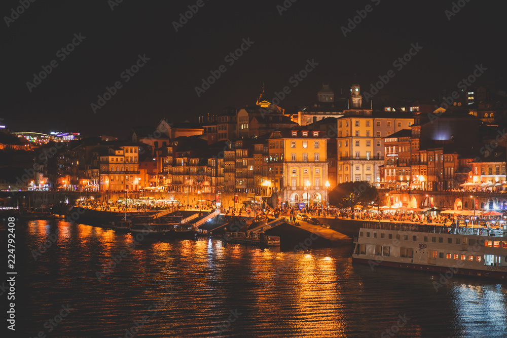 Beautiful super wide-angle panoramic summer aerial view of Old Porto Oporto city and Ribeira Square with the old town, during the sunset over Douro river from Vila Nova de Gaia, Porto, Portugal