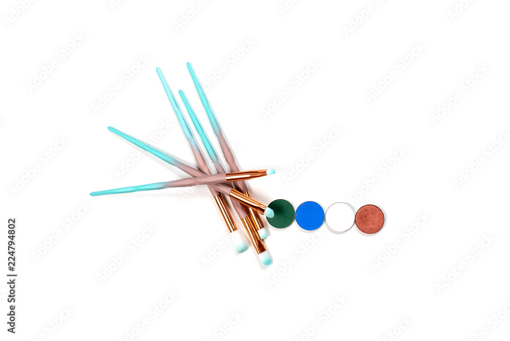 isolated colourful makeup eye brushes kit mint blue with skin powder top view on white isolated colourful makeup eye brushes kit mint blue with skin powder top view on white