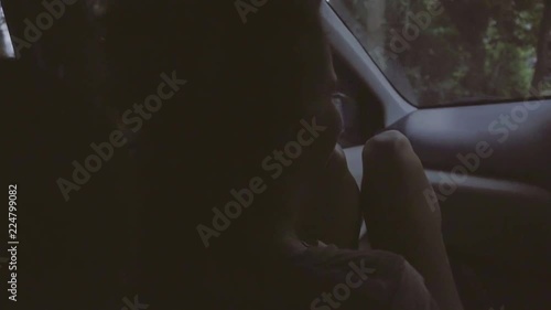 Wallpaper Mural Camera shows how car rides with mature pretty woman sitting on front seat, then handsome long haired guy in t-shirt sitting on back seat, they smiling on sunny summer day. Torontodigital.ca