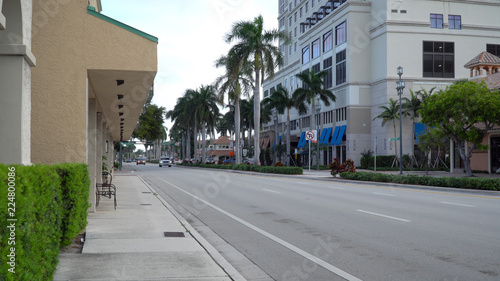 Downtown east Boca Raton Florida day time exterior establishing shot photo of street view traffic passing businesses stores and hotels