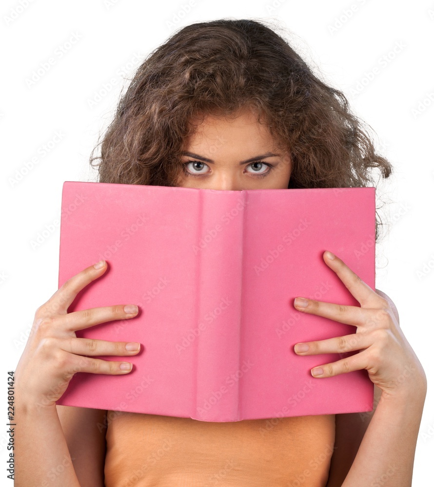 Reading and hiding behind a book Reading and hiding behind a book