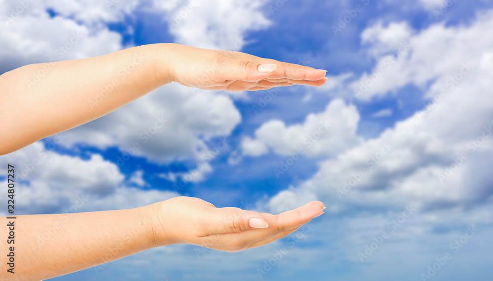 human hand gesture something with sky background