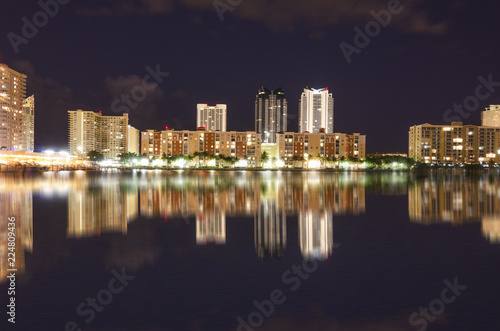 Night scene of Miami Skyline with reflections in the canal