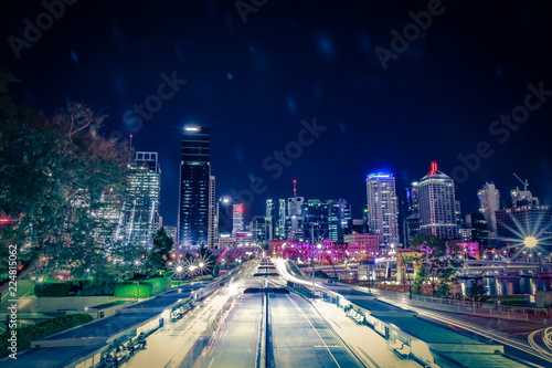 Illuminated city street in traffic lines