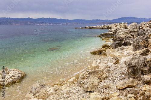 background image of rocky seashore on different Islands of Greece, Rhodes, KOs, Santorini, Halkidiki, Crete, Simi, Corfu