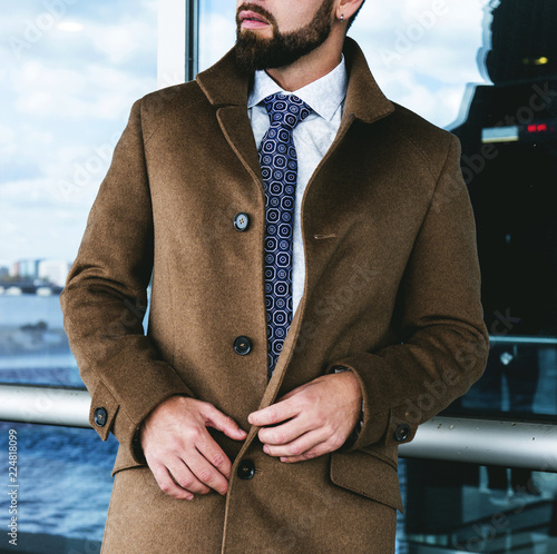 The man in a fashionable business coat photo