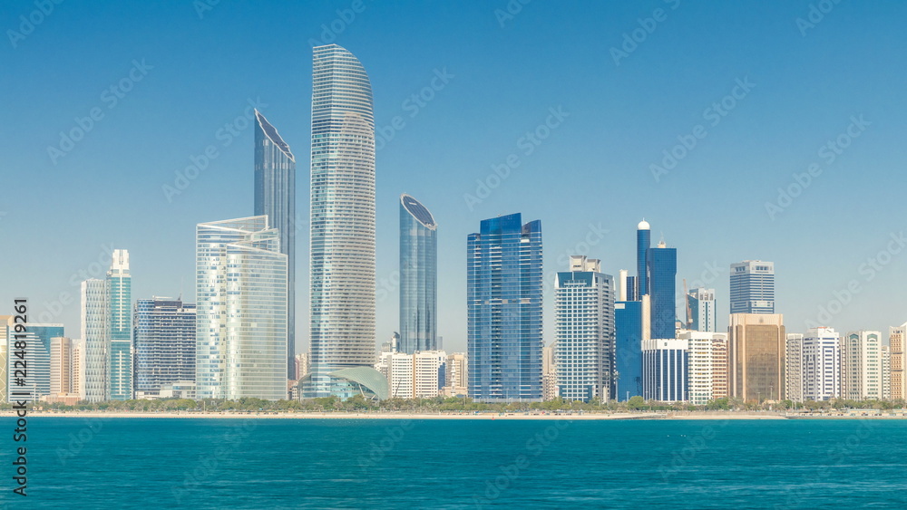 Obraz premium View of high skyscrapers on a corniche in Abu Dhabi stretching alongside the business center timelapse.
