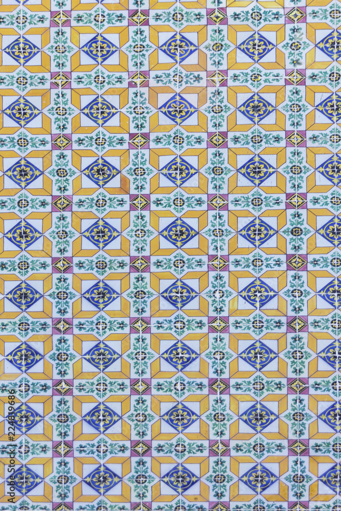 background image of old colorful Portuguese tiles Azulejos, historical patterns, covering the old house in Portugal