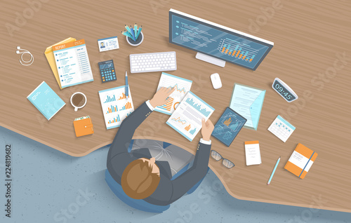 Man working in office at the table. Workplace Desktop Workspace Armchair, business office supplies, monitor, laptop, calendar, notepad, folder, envelope, books. Charts, graphics on the screen. Vector