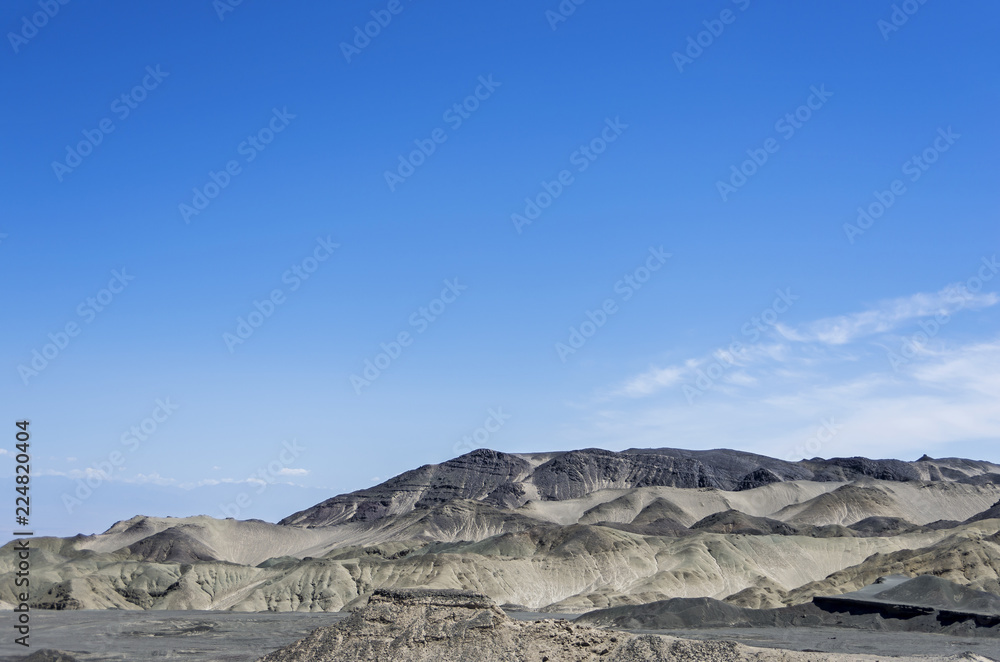 Desert and mountain over blue sky and white clouds on altiplano