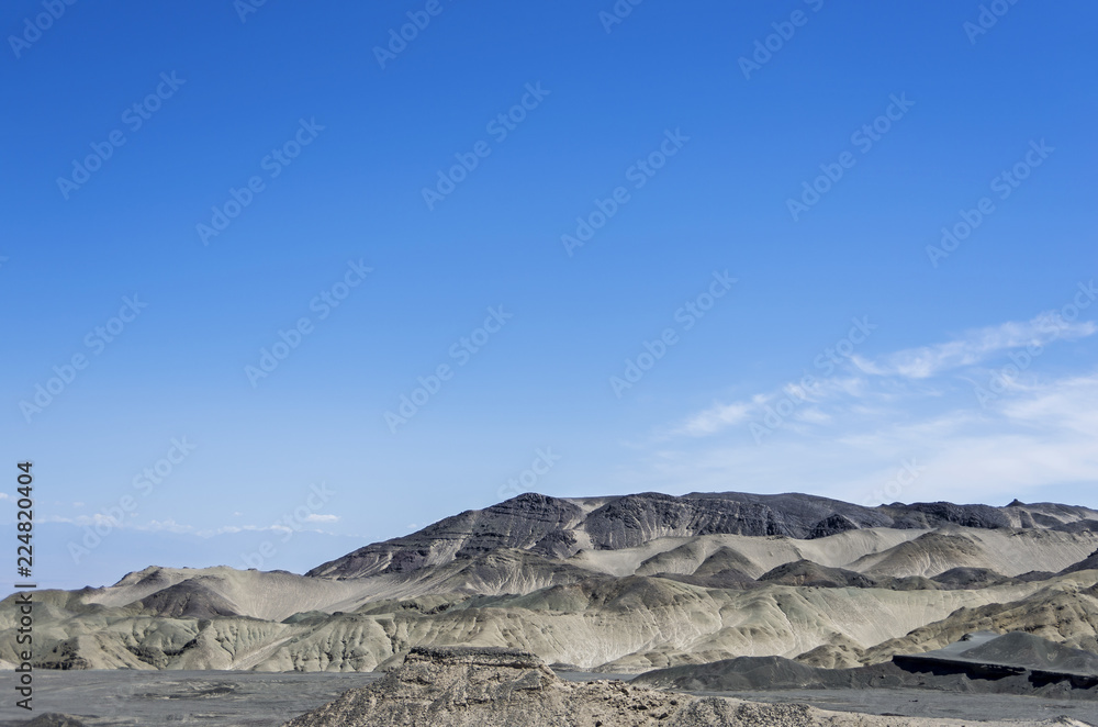 Desert and mountain over blue sky and white clouds on altiplano Desert and mountain over blue sky and white clouds on altiplano