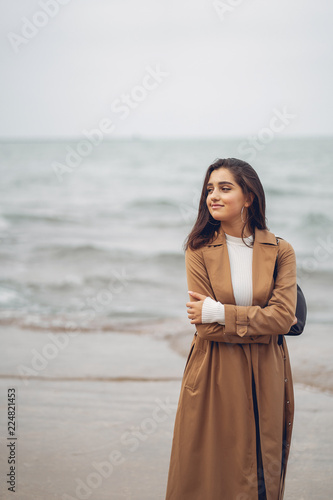 young girl walking on the beach