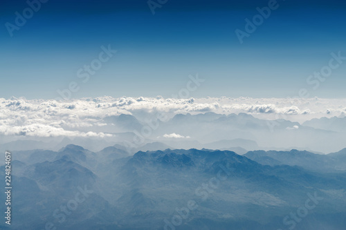 Sunny view of atmosphere above the clouds in Europe.