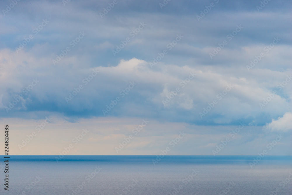 Clouds over the sea, background seascape before the rain Clouds over the sea, background seascape before the rain