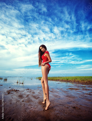 Girl in a red swimsuit on the Bay