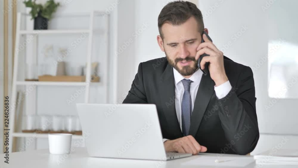 Businessman Talking on Phone, Negotiating with Customer Businessman Talking on Phone, Negotiating with Customer