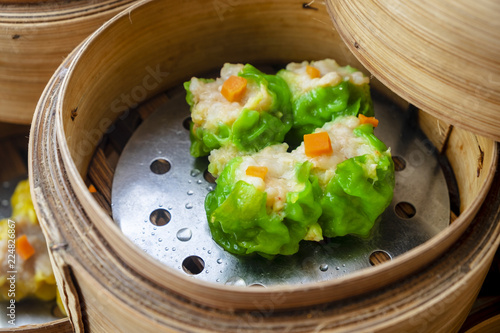 Green Pork and Shrimp Dim Sum on the Table, Steamed Traditional Chinese Cuisine Food photo