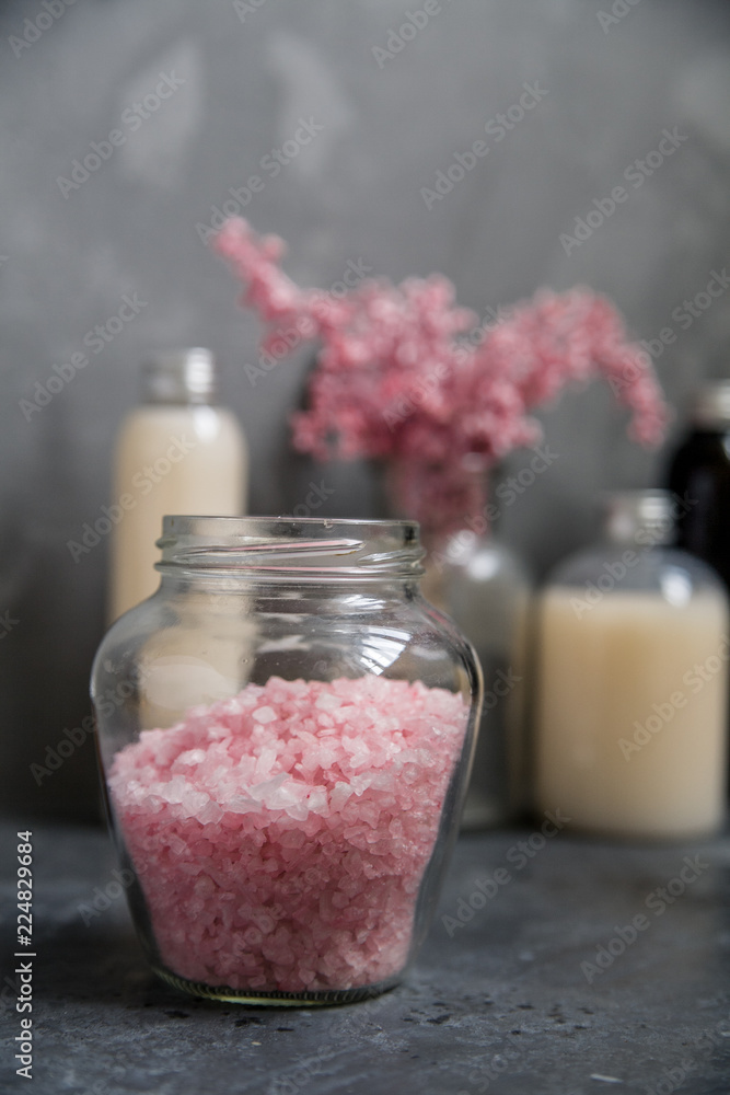 Natural spa cosmetics on a dark blue beton concrete background. Beauty blogger, minimalism concept, copy space Natural spa cosmetics on a dark blue beton concrete background. Beauty blogger, minimalism concept, copy space