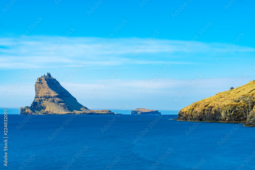 Tindholmur island. View from Bour village on Vagar island, the Faroe Islands.
